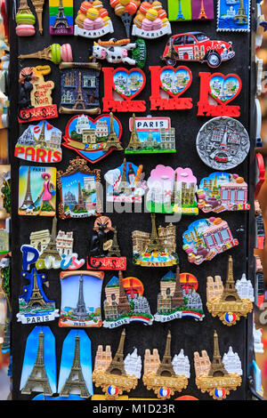 Novelty fridge magnets and typical Eiffel Tower souvenir gifts and knick-knack on display in Montmartre, Paris, France Stock Photo