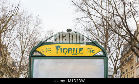 Pigalle Metro station sign with famous Art Nouveau style subway station entrance design exterior, in the Pigalle entertainment district, Paris, France Stock Photo