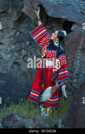 Willow Abrahamson poses along a basalt cliff at Twin Falls State Park in Idaho. model release yes. Stock Photo