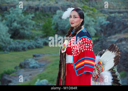 Willow Abrahamson poses along a basalt cliff at Twin Falls State Park in Idaho. model release yes. Stock Photo