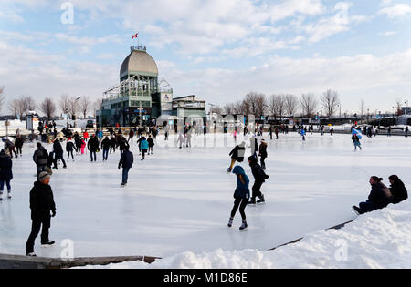Skaters on the ice skating rink in the Old Port (Vieux Port) area of Montreal, Quebec, Canada Stock Photo