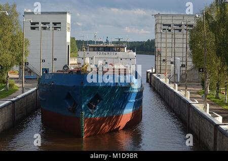 FREIGHTER 'TOLYATTI'  IN LOCK 1 ON THE KOVZHA RIVER BOUND FOR LAKE LADOGA, RUSSIA. Stock Photo