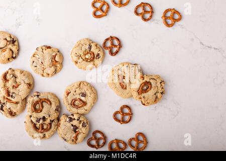 Chocolate chips and pretzels cookies on a marble table Stock Photo