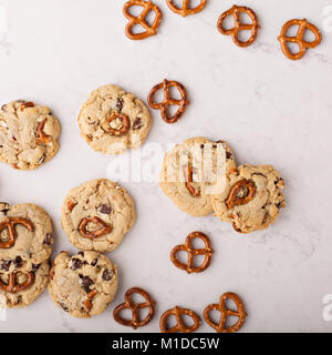 Chocolate chips and pretzels cookies on a marble table Stock Photo
