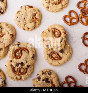 Chocolate chips and pretzels cookies on a marble table Stock Photo