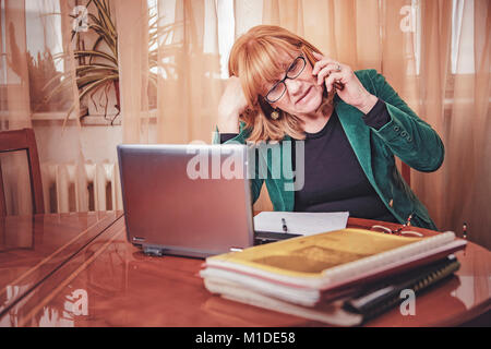 Elderly lady discussing some serious matters Stock Photo