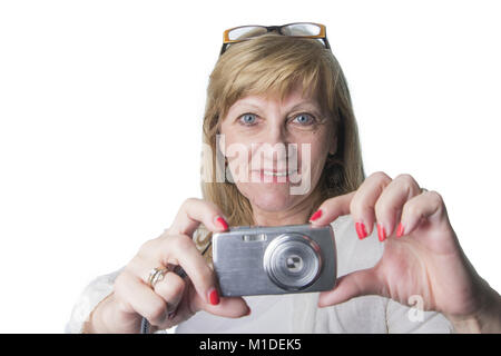 Elderly lady using a compact camera Stock Photo - Alamy