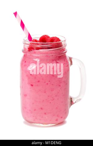 Raspberry smoothie in a mason jar glass with striped straw isolated on white