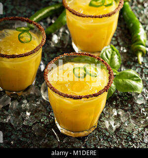 Spicy mango margaritas with hot pepper Stock Photo