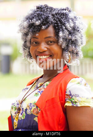 Portrait of fashionable young Kampala woman with stylish black and white curls. Stock Photo