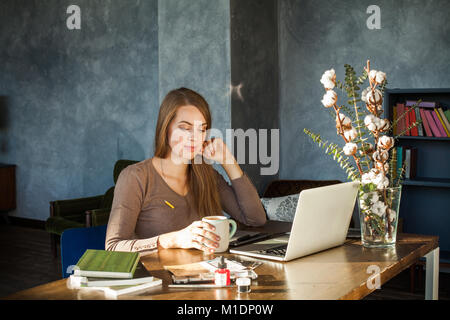 Cute Woman Drinking Coffee. Coffee Break during the Working Day Stock Photo