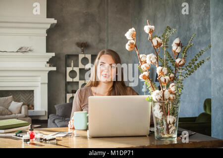 Cheerful Model Woman Using Computer. Portrait of Beautiful Happy Smiling Young Woman with Laptop Stock Photo
