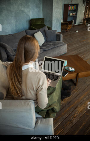 Laptop Screen with Copy Space and Female Back on Background Stock Photo