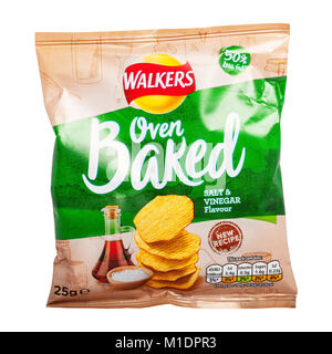 A packet of Walkers oven baked salt & vinegar flavour crisps with 50% less fat on a white background Stock Photo