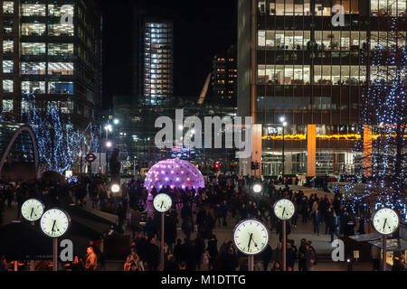 LONDON, UK-25 JAN 2018: Sonic Light Bubble by ENESS is surrounded with commuters at Jubilee Plaza for the Canary Wharf's Winter Lights Festival 2018.