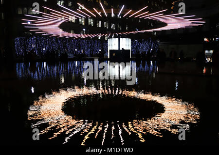 LONDON, UK-25 JAN 2018: Halo by Venividimultiplex and Fosfor Design is on public display at Cabot Square for the Canary Wharf Lights Festival 2018. Stock Photo