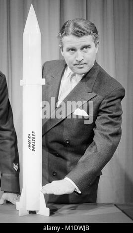 Dr. Wernher von Braun (1912-1977) with model of a REDSTONE guided missile, January 20, 1956.