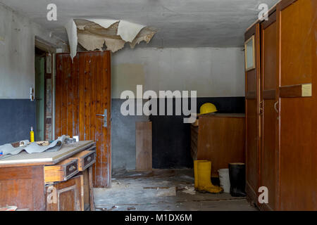 EISENBERG Germany- July 17, Abandoned office with dusty desk in Eisenberg Germany, July 15, 2017 in Eisenberg, Rhineland-Palatinate, Germany Stock Photo