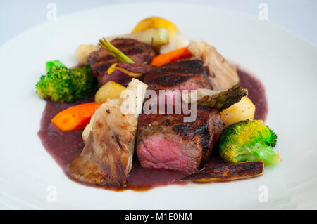 beef sirloin with broccoli, mushrooms, carrots and potatoes in a wine sauce Stock Photo