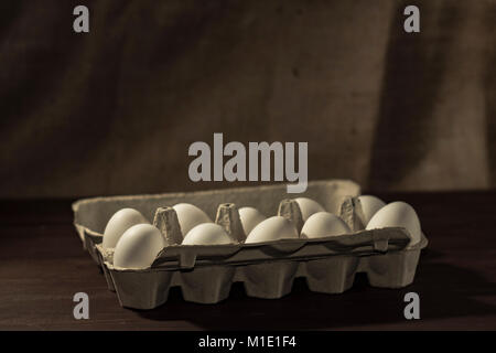 Chicken eggs in a cardboard tray. Stock Photo