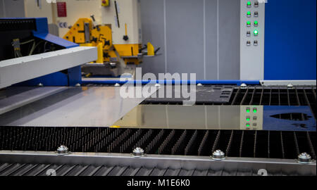 CNC laser cutting machine cut sheet of metal Stock Photo