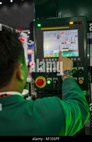 Technician input data programing for CNC machine Stock Photo
