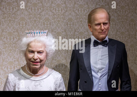 Wax statues of Queen Elizabeth II and Prince Philip at the Krakow Wax Museum - Cracow, Poland. Stock Photo
