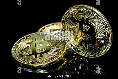 Bitcoin, Golden Bitcoins on a black background .Photo new virtual money Stock Photo