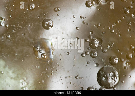 Abstract image of bubbles on the water, on a colored background. Stock Photo