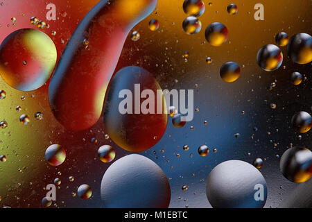 Abstract image with colorful circles and shapeless bodies on a colored background. Stock Photo