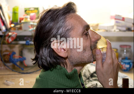 Medical inhalation Man with mask on his face. Nebulizer device Stock Photo