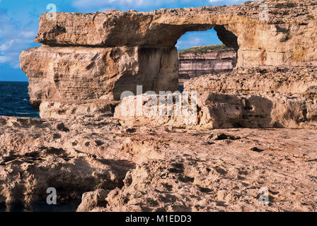 Azure window, natural stone arch by Dwejra cliffs at western Gozo island, Malta Stock Photo