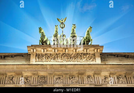 Illuminated quadriga on top of Brandenburg Gate in Berlin, Germany Stock Photo