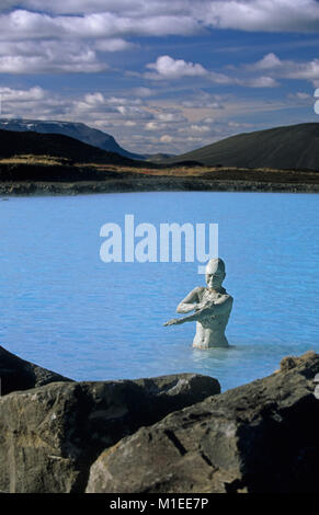 Iceland. Myvatn. Myvatn Nature Baths. Woman wearing beauty mask, towel on head, sitting in geothermal spa. Stock Photo