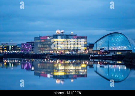 Night view of BBC Scotland Studio at Pacific Quay beside River Clyde  in Glasgow, Scotland, United Kingdom Stock Photo