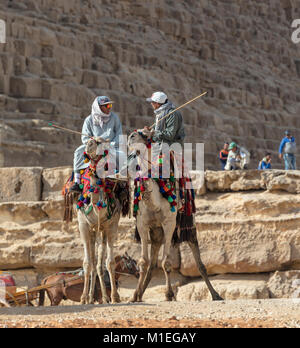 Two camel drivers in front of the Khufru pyramid at Giza Stock Photo