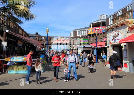 SAN FRANCISCO, USA - APRIL 8, 2014: People visit Fisherman's Wharf in San Francisco, USA. San Francisco is the 4th most populous city in California (8 Stock Photo