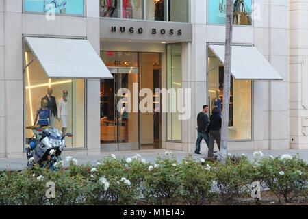 LOS ANGELES, USA - APRIL 5, 2014: Shoppers visit Hugo Boss store in Beverly Hills, Los Angeles. Hugo Boss is a German luxury fashion house 263 million Stock Photo