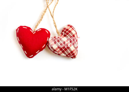 Two red fabric hearts on isolated on white background Stock Photo