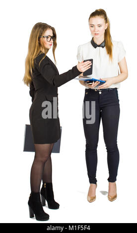 Beauty blonde businesswomen holding documents and interacting. Concept of teamwork. Stock Photo