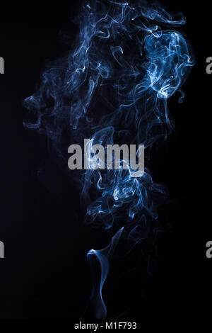 Rich swirls of smoke, black background Stock Photo