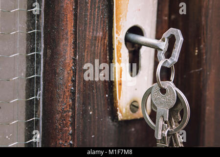Set of keys in an old rustic lock