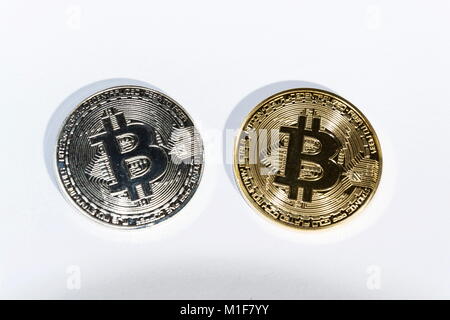Pair of bitcoin coins isolated on white background, cryptocurrency investing Stock Photo