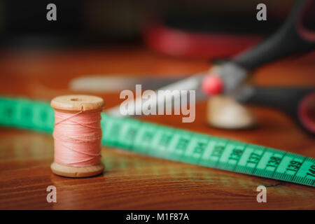 Clothing accessories,thread, scissors and measuring tape Stock Photo