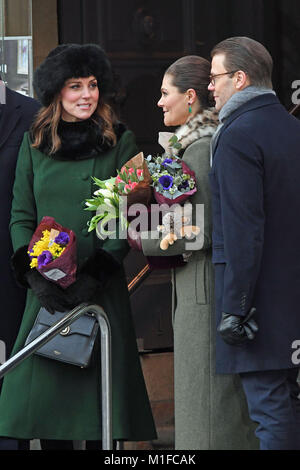 The Duchess of Cambridge, accompanied by Crown Princess Victoria and Prince Daniel of Sweden, walk from the Royal Palace of Stockholm to the Nobel Museum on the first day of their visit to Sweden. Stock Photo
