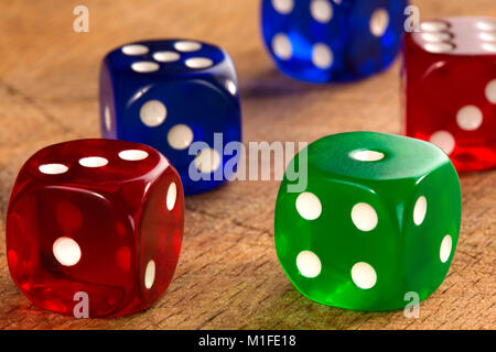 Close up of colorful dices background on wood background Stock Photo