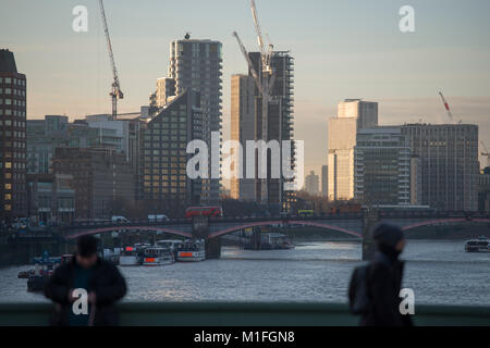 Westminster Bridge, London, UK. 30th Jan, 2018. UK Weather. UK Weather. Strong sunlight and frost greets morning commuters at rush hour on Westminster Bridge with views upstream towards Vauxhall. Credit: Malcolm Park/Alamy Live News. Stock Photo