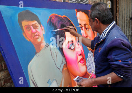 Bangladeshi artist drawing film banner at Old Town in Dhaka City, Bangladesh, on January 30, 2018. Film banner painting is one of the extinct arts works in Bangladesh. Stock Photo