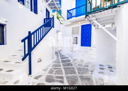 Mykonos, Greece. Whitewashed dotted alley in old city, Cyclades Greek Islands. Stock Photo