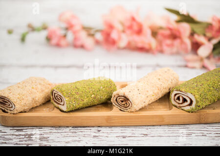 slice of Homemade Sweet roll with chocolate and vanilla on white background. Stock Photo